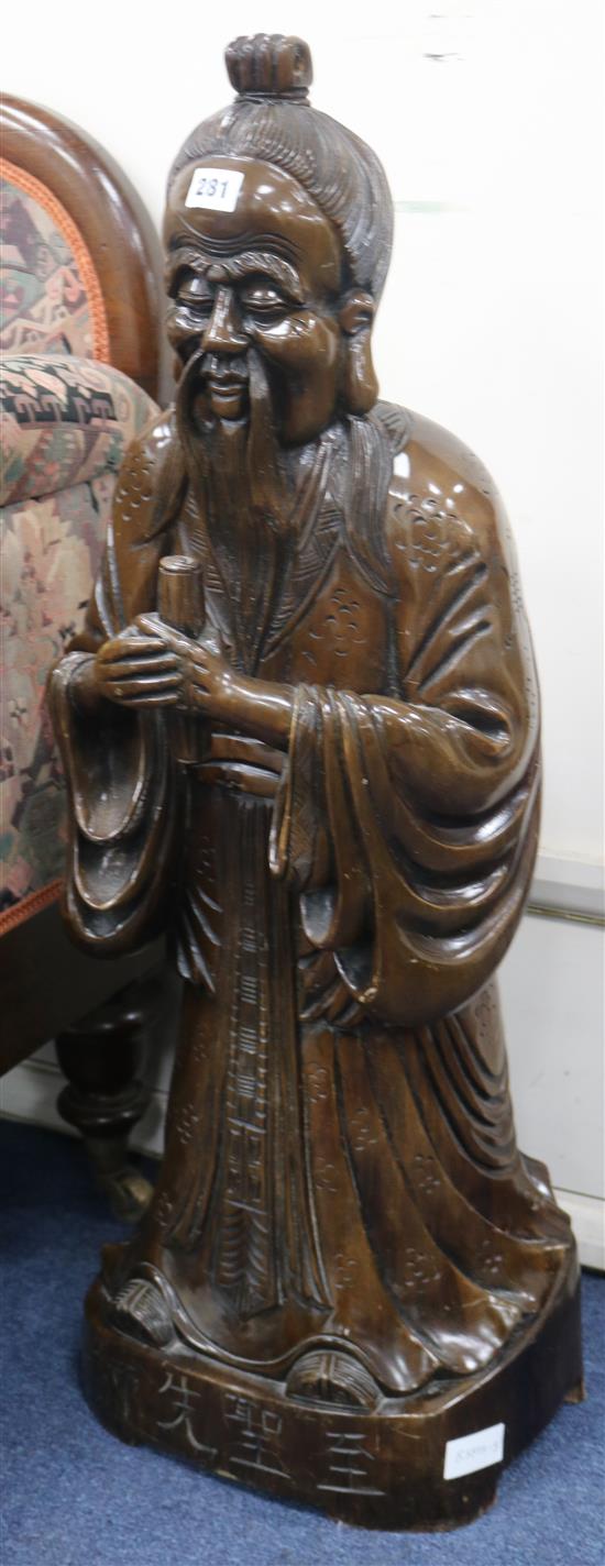 A large Oriental wood figureof a sage